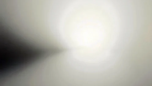 Radial gradient light with central glow and dark tapering edge.