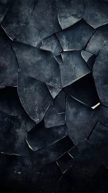 Fragmented slate geometry with dark crystalline surface treatment.