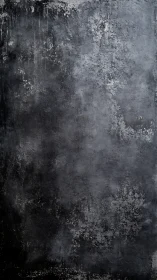 Textured dark concrete wall surface shows worn gray patches