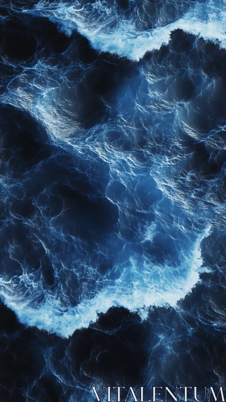 Storm-lit midnight waves in deep blue aerial seascape.
