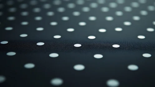 Soft-focus polka dot fabric shows subtle ridge detail