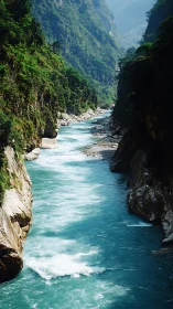 Mountain gorge river flows between steep, vegetated cliffs