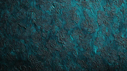 Embossed teal floral relief surface with directional metallic sheen.