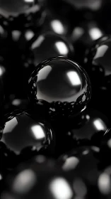 Gleaming black spheres capture soft light in abstract space