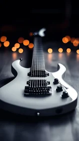 White electric guitar in shallow depth of field studio lighting