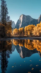 Golden autumn mountains glow above a mirror-still lake