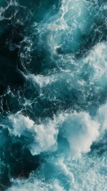 Churning turquoise ocean waves captured from above.