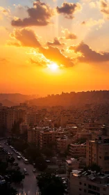 High-density urban skyline under radiant orange sunset haze