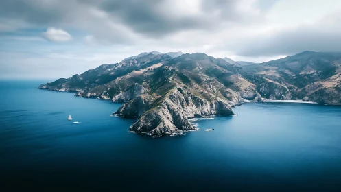 Rugged Peninsula Rises From Sapphire Waters Below