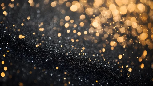 Elegant black and gold bokeh abstract background with glitter effect.
