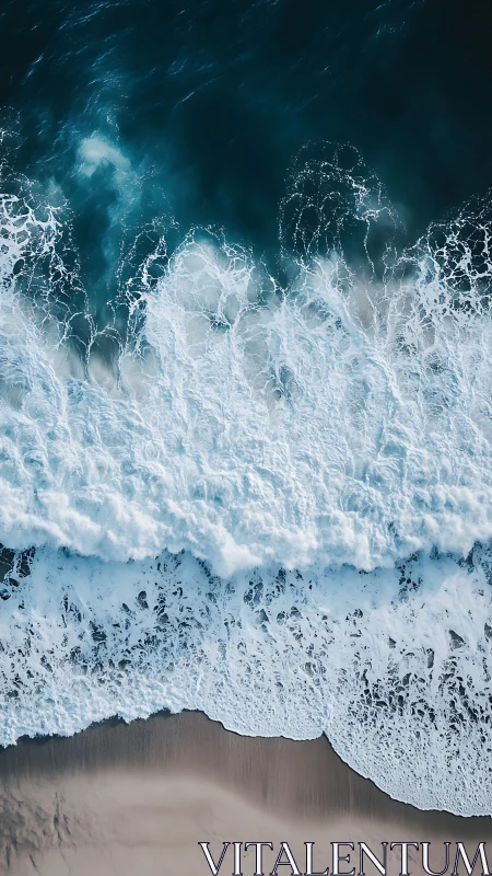 Foaming ocean waves crash onto a tranquil sandy shoreline