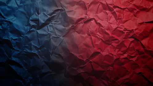 Crumpled red and blue paper creates a bold textured divide