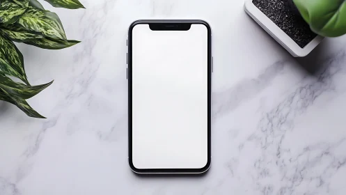 Smartphone Mockup on Marble Surface with Desktop Accessories.