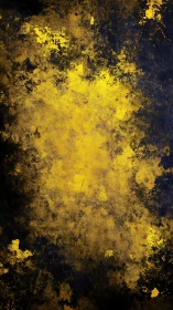 Yellow pigment dispersion on dark textured surface background.