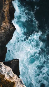Seafoam thunder collides with rugged cliffside edges.
