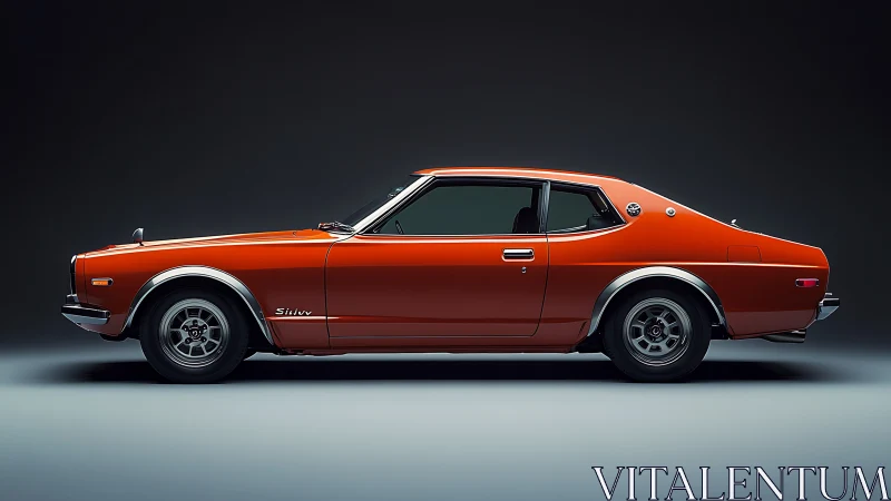 Vintage orange coupe stands in dramatic studio side profile.