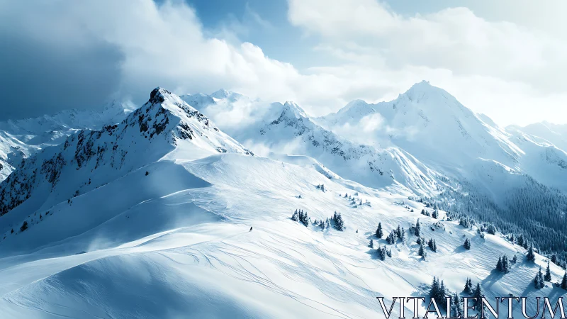 High alpine snow ridge with backcountry ski tracks at dawn