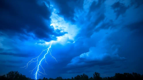 Lightning scribbles bright electricity across midnight clouds