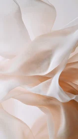 Translucent peach textiles form layered, undulating abstract planes