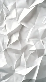 Origami-inspired white paper relief with angular folds study.