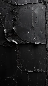 Cracked black plaster wall reveals rugged urban texture