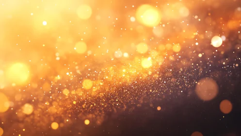 Golden bokeh light background with sparkling glowing particles.