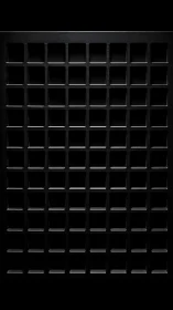 Black metal grid panel casts deep square recess shadows