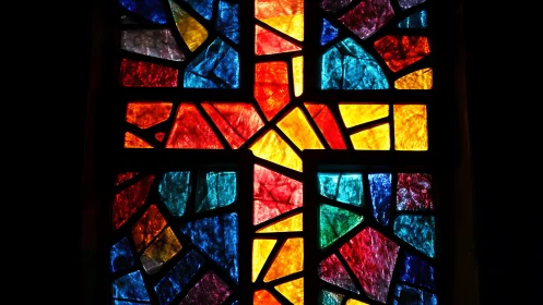 Cruciform stained glass window reveals prismatic chromatic geometry