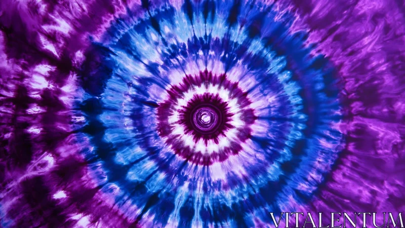 Spiraling tie-dye rings glow in vivid purple and blue waves