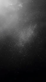 Silent starfield drifting through charcoal cosmic hush.