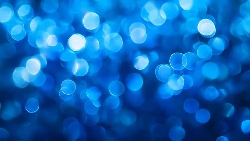 Abstract blue bokeh lights background with soft, dreamy effect.