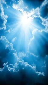 Bright sunburst breaking through deep blue storm clouds.