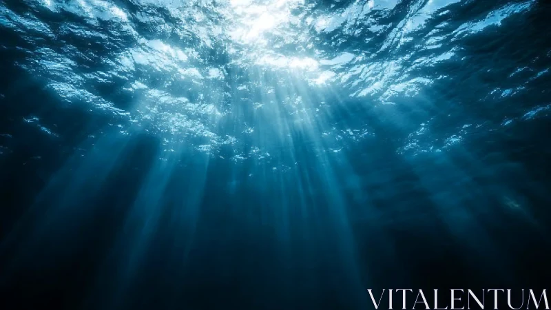 Sunlight pierces deep blue ocean water in tranquil silence