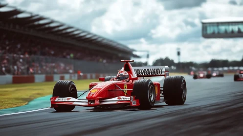 Red Formula 1 car accelerates on dry circuit straight