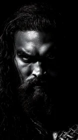 High-contrast monochrome portrait sculpts an intense gaze