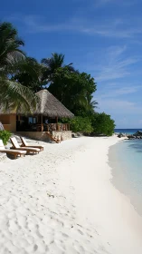 Tropical Beach Bungalow with Thatched Roof Overlooking Clear Waters.