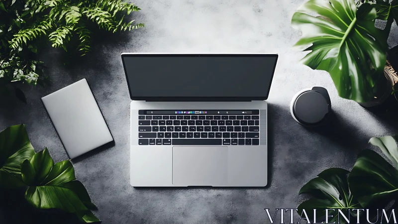 Laptop on concrete desk with plants and accessories.