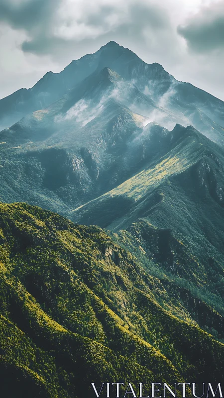 Mist kissed mountain ridges bathed in gentle morning light.
