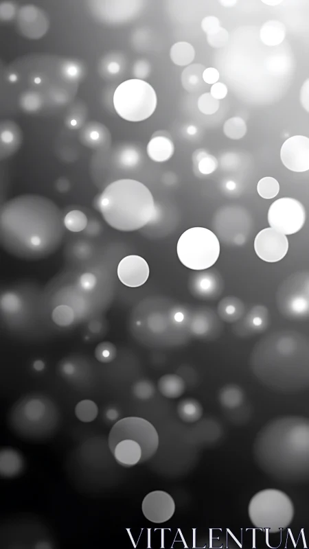 Soft grayscale bokeh constellation drifting in quiet glow.