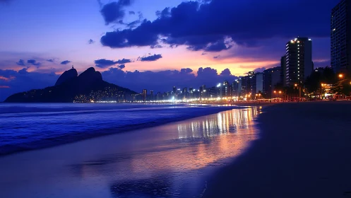 Rio beachfront skyline glows under deep blue twilight sky
