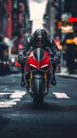 Motorcyclist rides a red sport bike through an urban street