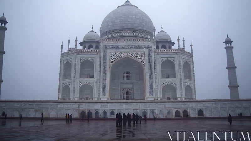 Fog-laden white marble mausoleum with domes and minarets.