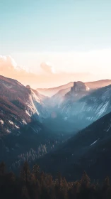 Sunlit alpine valley with misty peaks and soft pastel sky.
