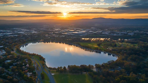 Aerial sunset panorama maps reflective urban lakeside basin