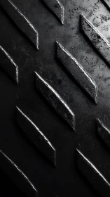 Rugged steel chevron ridges whisper in stark monochrome light