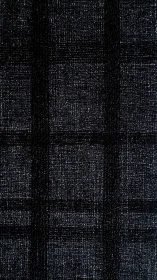 Dark woven plaid textile shows subtle grid texture.