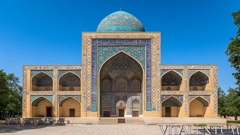 Islamic madrasa facade with blue tiled dome under clear sky