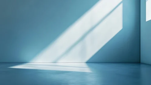 Empty blue room with sharp diagonal sunlight and shadows.