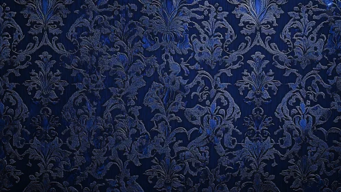 Ornate blue damask textile reveals embossed floral arabesques