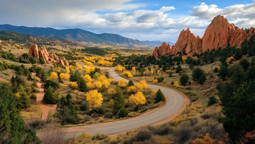 Curving roadway passes between red rock formations and trees